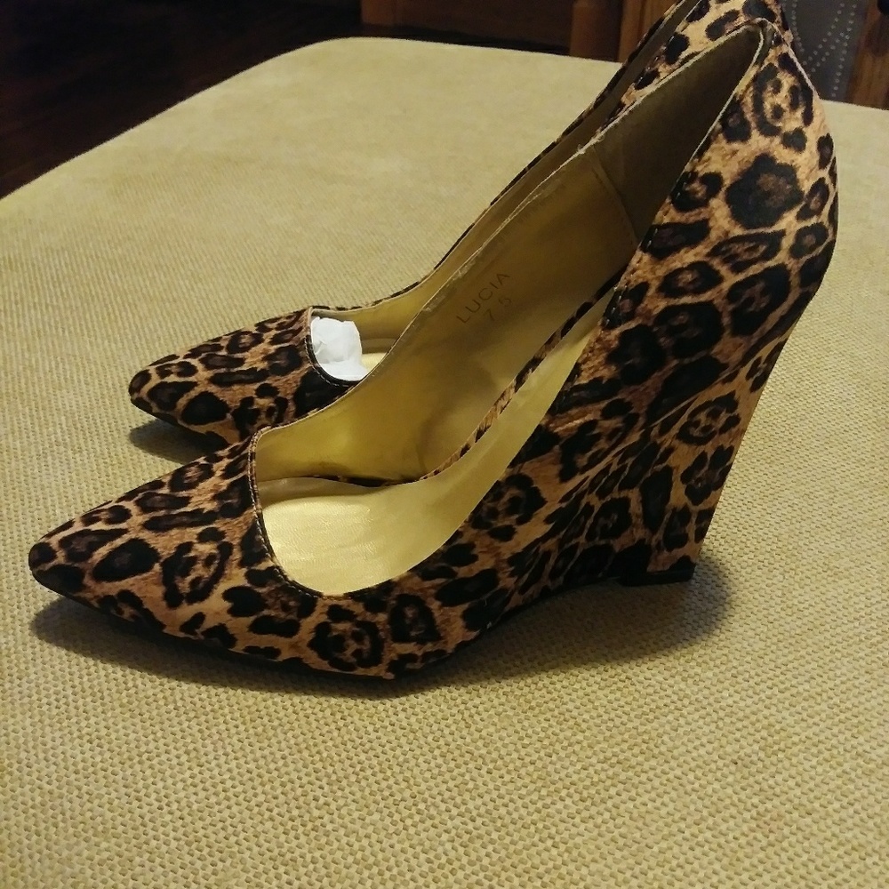 Leopard tall wedge heel pumps.